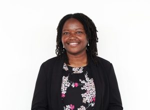 Regina Minael Fupi Presents Research at Mwalimu Nyerere International Symposium